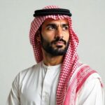 portrait of thoughtful arab man in traditional clothing looking to side photo